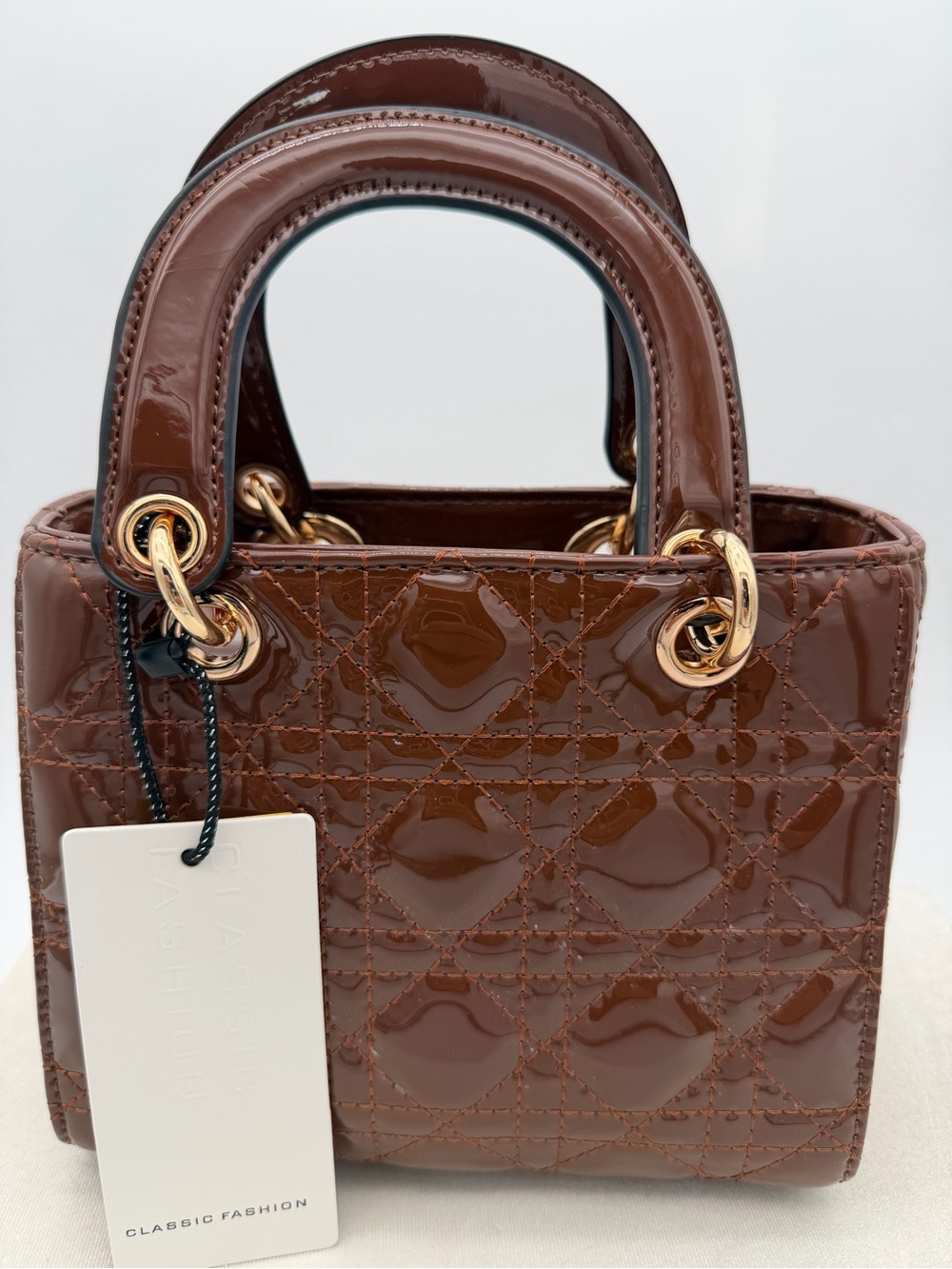 Beautiful, Brown Patent leather mini Bag with Gold Charm - Picture 2 of 15